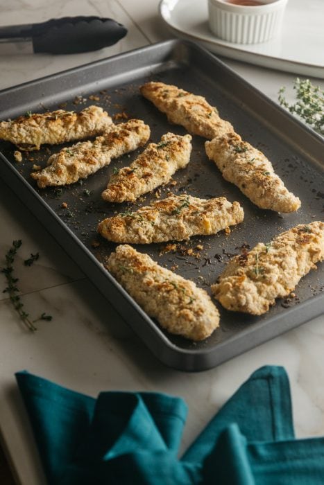 keto chicken tenders on a baking sheet