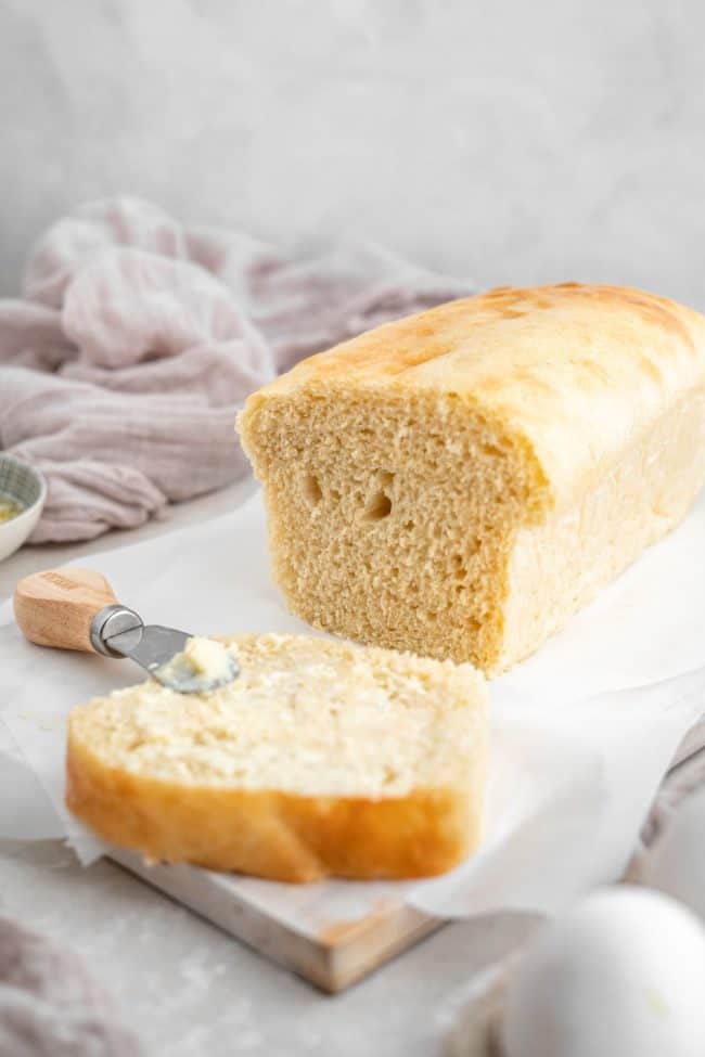A side shot of low carb bread with a knife