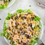 A close up shot of big mac salad in a white bowl